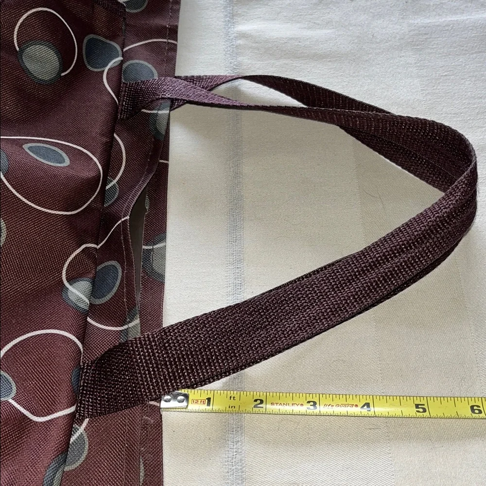 All purpose Brown Polka Dot Vinyl Tote Bag Open at top with side pockets.